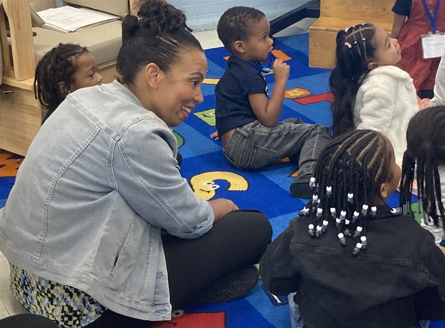 Melissa Barrow sits in on a class at the Early Learning Center